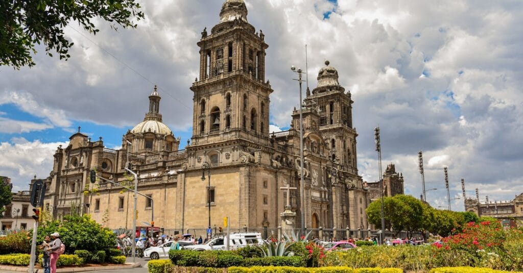 Beautiful view of the Metropolitan Cathedral in CDMX, Mexico, showcasing its stunning architecture under a vibrant sky.