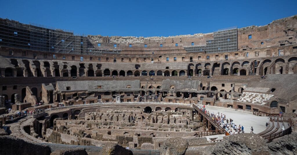 Explore the historic Colosseum in Rome, Italy, showcasing ancient architecture and sunlight in summer.