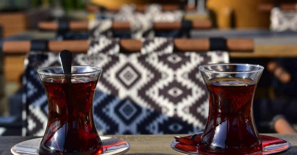 Traditional Turkish tea served in glasses on a wooden table in an Istanbul café.
