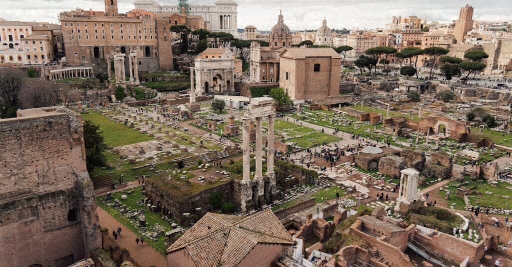 Explore the majestic ruins of the Roman Forum from above, showcasing ancient history and iconic Roman architecture.