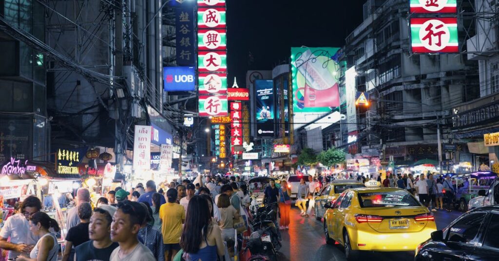 Lively city street at night with crowds, neon lights, and busy traffic. Immersive urban experience.