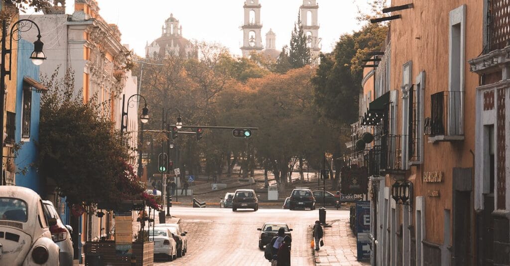 Charming street scene in Heroica Puebla de Zaragoza capturing colonial architecture and city life.
