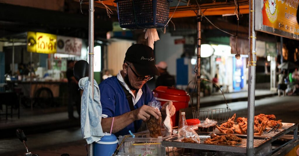 Nighttime street food vendor in Bangkok, capturing the vibrant city life and local cuisine.