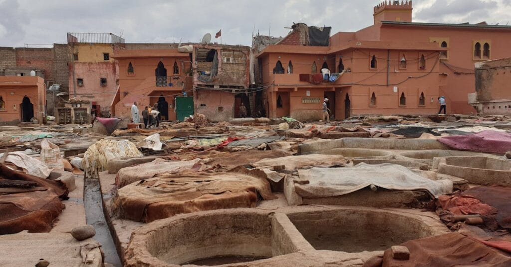 Explore a traditional tannery in Marrakech, Morocco, showcasing age-old leather production techniques.