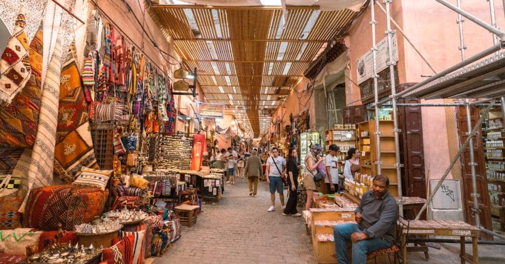 Explore the vibrant colors and lively atmosphere of a Marrakech souk, showcasing traditional crafts and local culture.