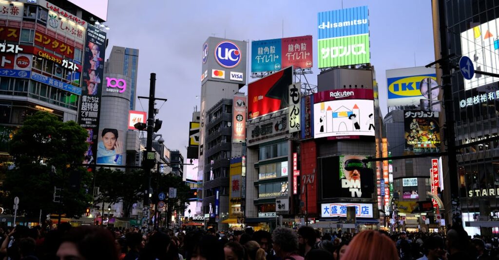 Bustling street scene at Shibuya Crossing, a famous urban landmark in Tokyo, Japan, at night.