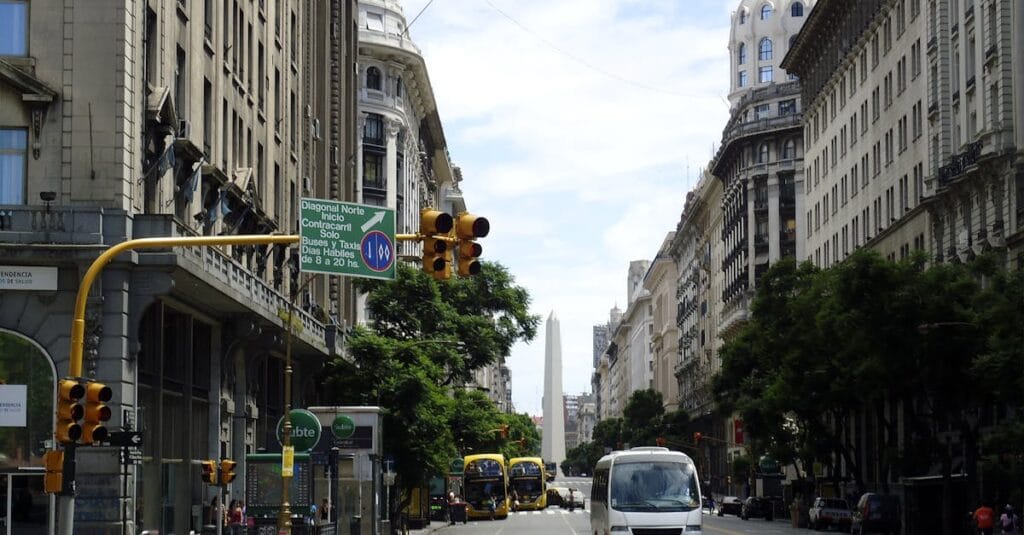 View of Buenos Aires city street featuring historic architecture and the famous Obelisk.
