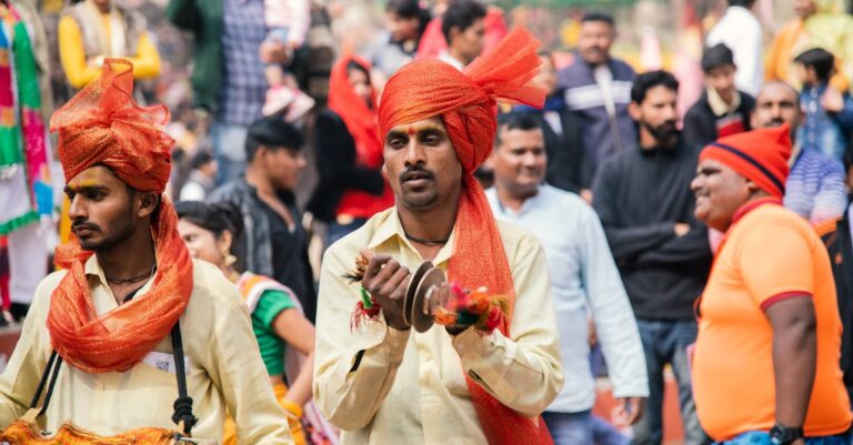 Vibrant street festival in India featuring traditional musicians in colorful attire.