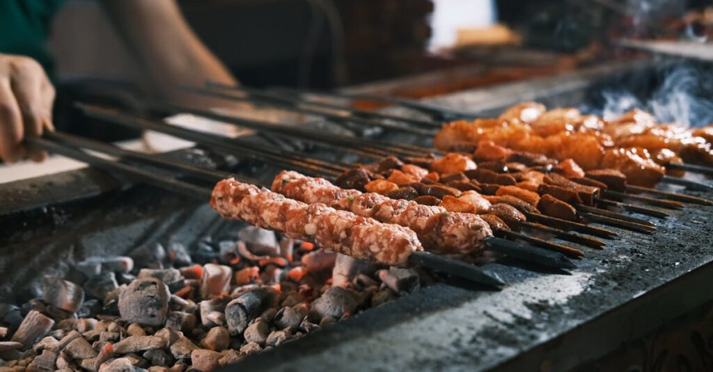 Delicious traditional Turkish kebabs grilling over hot coals in Diyarbakır, showcasing authentic cuisine.