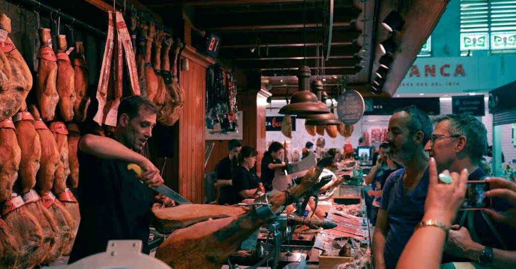 A bustling Barcelona market scene featuring a butcher slicing authentic Spanish jamón.