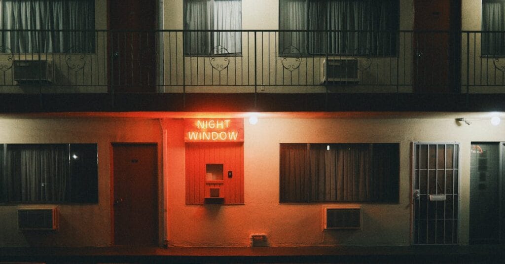 A nighttime view of a motel with a neon sign in Los Angeles, California.