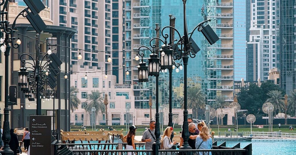 Scenic view of Dubai Marina promenade with people enjoying the skyline and waterfront.