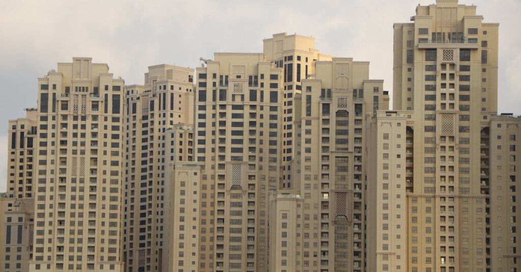 Tall residential skyscrapers characterize the iconic skyline of Dubai Marina, UAE.