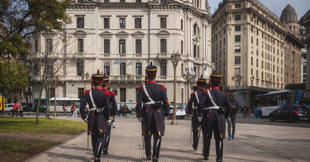 Granaderos soldiers marching in front of historic architecture in Buenos Aires, Argentina.
