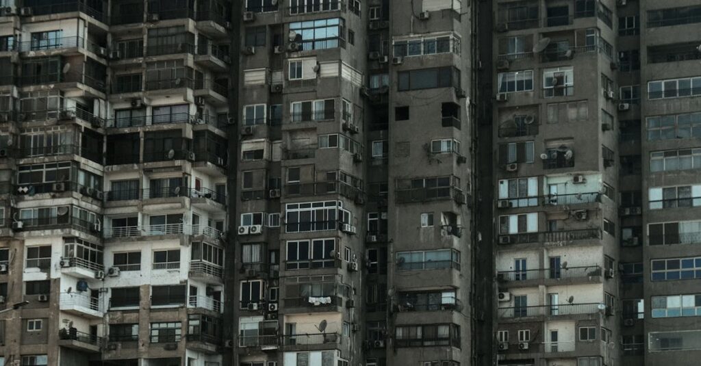 Gritty facades of high-rise apartments depicting urban density in Cairo, Egypt.