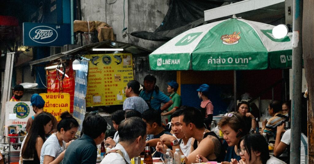 Outdoor dining scene capturing the bustling atmosphere of Bangkok's Chinatown.