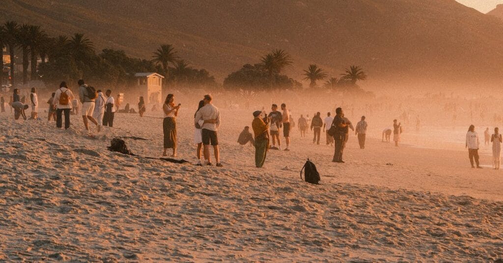 Breathtaking sunset view of Camps Bay Beach with Table Mountain in Cape Town, South Africa.