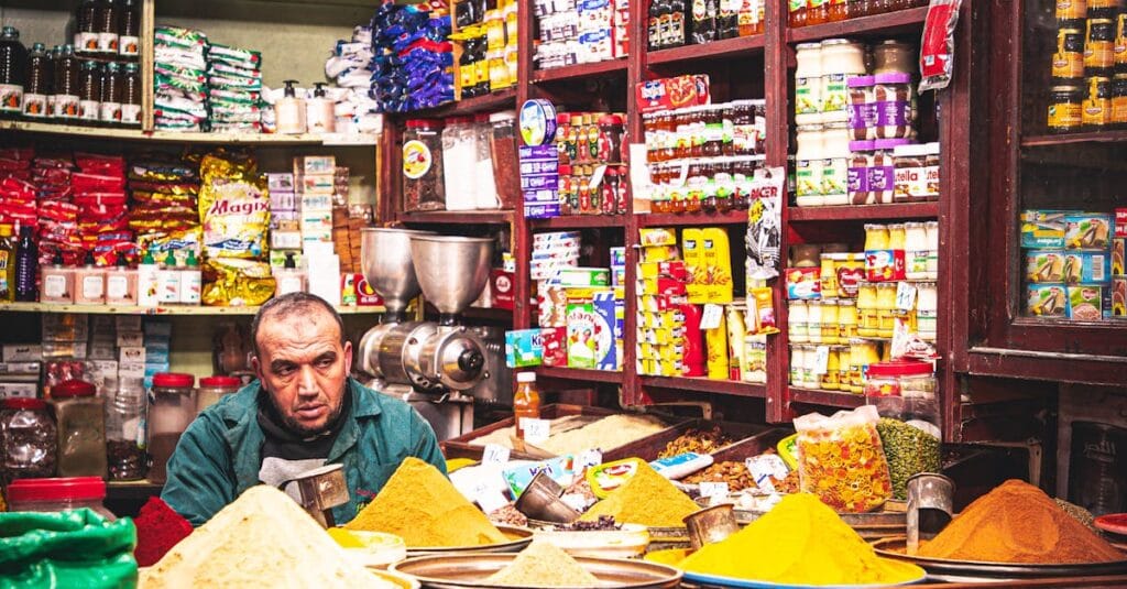 Vibrant spice and goods display in a Marrakesh shop showcasing Moroccan culture and goods.
