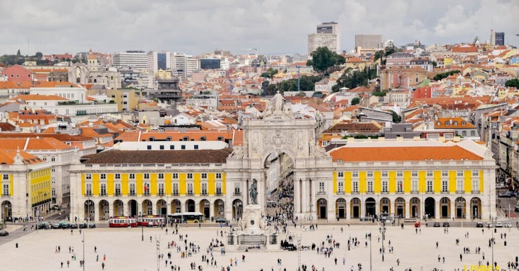 Aerial view of Praça do Comércio in Lisbon, showcasing the iconic arch and bustling square.