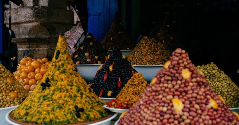 Vibrant array of spices and condiments on display in Essaouira market, Morocco.