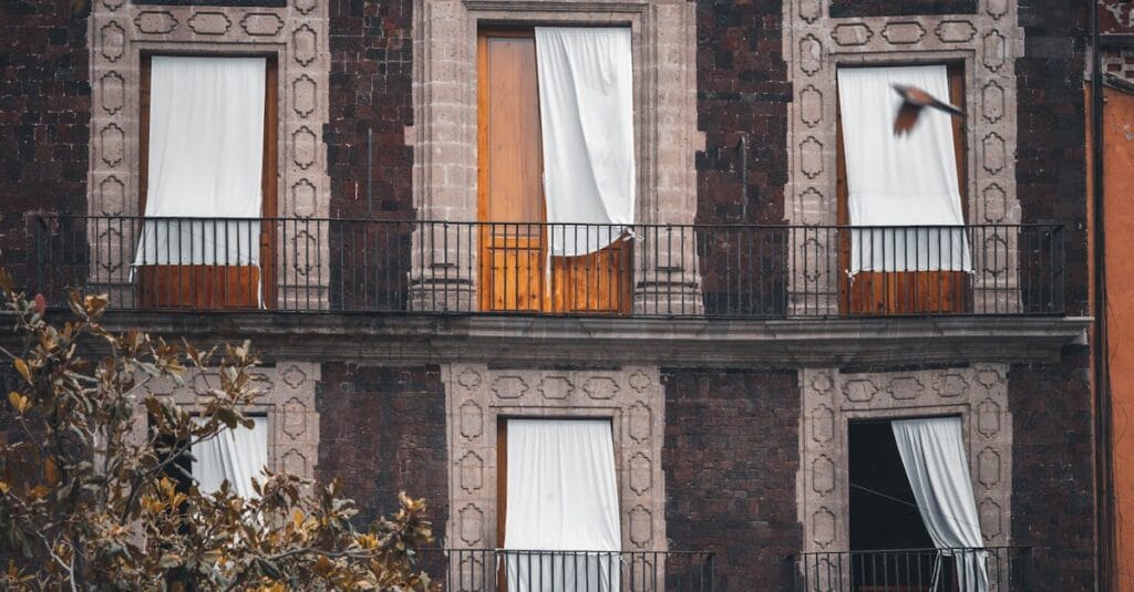A detailed view of antique balconies and facade in Mexico City, capturing architectural elegance.