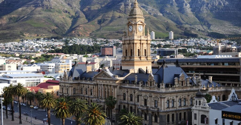 Stunning aerial view of Cape Town City Hall against Table Mountain backdrop in South Africa.